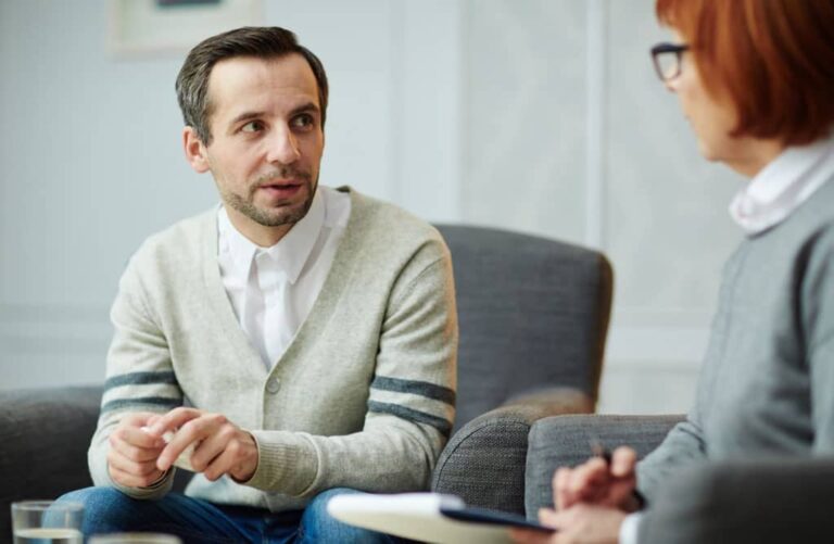 licensed therapist doing counselling with a male patient during therapy